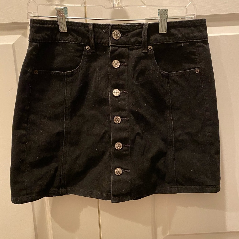 Brand new black jean skirt. Size 6.